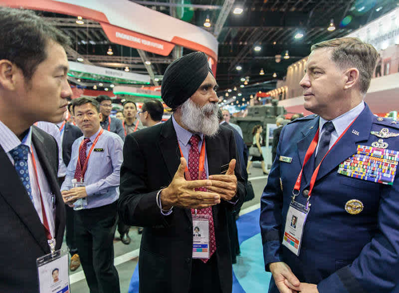 A group of VIP delegates interacting at Singapore Airshow